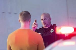 Policeman conducting drunk test