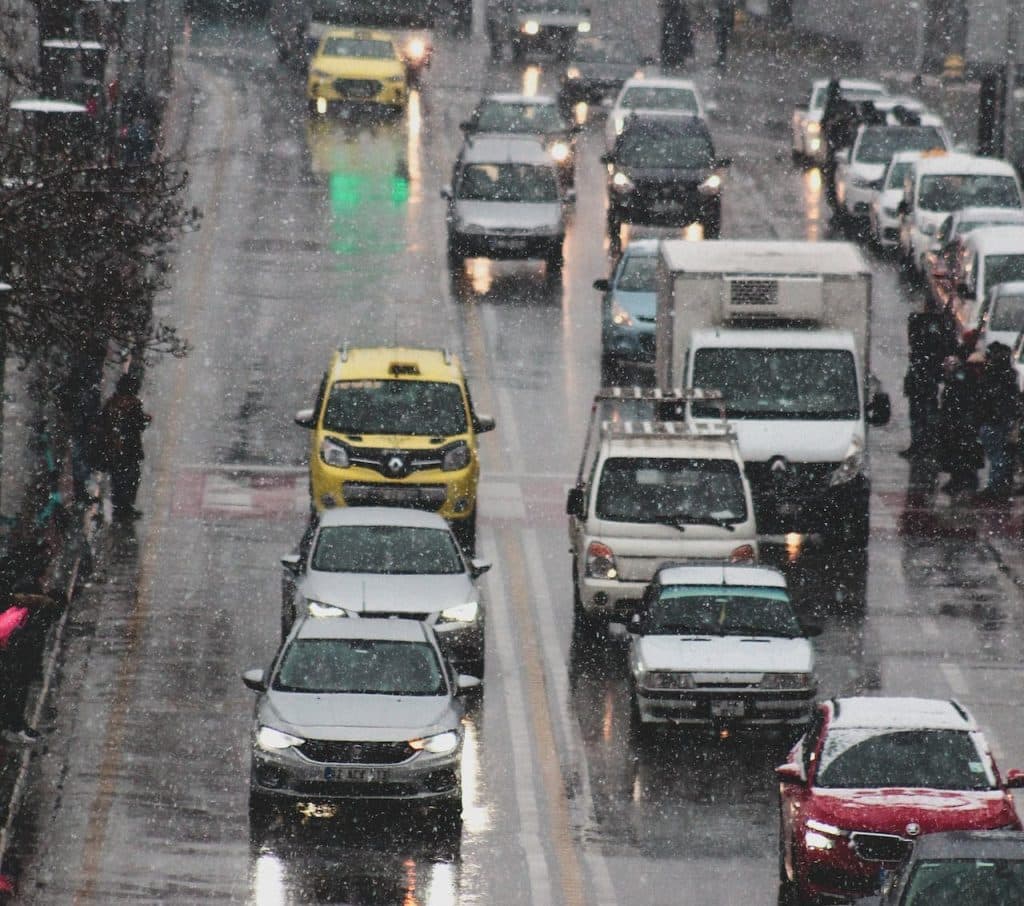 Auto vehicles sharing the road during winter