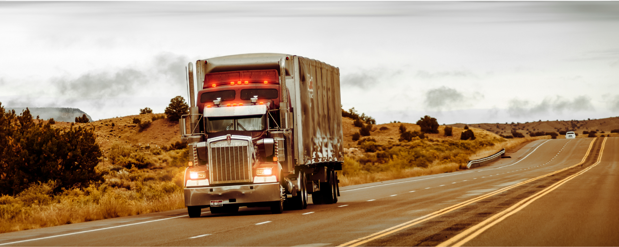 How Much Does It Cost to Hire a Truck Accident Lawyer?, Commercial truck in the road